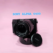 b) Sony A6400 Mirrorless Camera with 18-135mm f/3.5-5.6 OSS Lens | 24.2MP APS-C | 4K Video | Fast AF | SK522