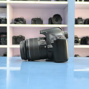 b) Canon EOS 3000D DSLR Camera with 18-55mm IS II Kit Lens | Beginner Friendly DSLR SK1028