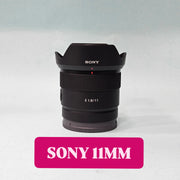 a) Sony E 11mm f/1.8 Ultra Wide-Angle Prime Lens | APS-C E-Mount | Fast f/1.8 Aperture | Lightweight Vlogging & Landscape Lens | SK1058