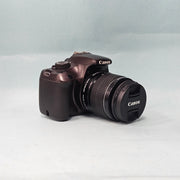 a) Canon EOS 1100D DSLR Camera with 18-55mm IS II Lens | 12.2MP APS-C | Beginner Friendly Camera | Lightweight DSLR | (Code AB01)