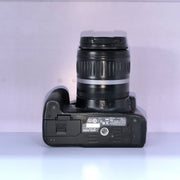 b) Canon EOS Rebel T1i DSLR Camera with 18-55mm Lens | 15.1MP | Full HD Video | Compact & Beginner Friendly | SK1032