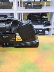 a) Panasonic HDC-MDH1 Professional Video Camera | Full HD Camcorder | 3MOS Sensor | 12x Optical Zoom | Built-in LED Light | Ideal for Events, Wedding & Video Production 🎥🔥