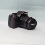 a) Canon EOS 550D DSLR Camera with 18-55mm IS II Lens | 18MP APS-C | Full HD Video | Beginner Friendly DSLR | Lightweight Camera | (Code AB05)