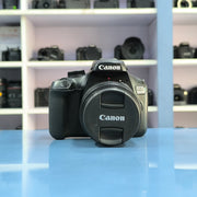 b) Canon EOS 3000D DSLR Camera with 18-55mm IS II Kit Lens | Beginner Friendly DSLR SK1028