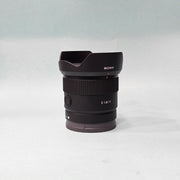 a) Sony E 11mm f/1.8 Ultra Wide-Angle Prime Lens | APS-C E-Mount | Fast f/1.8 Aperture | Lightweight Vlogging & Landscape Lens | SK1058