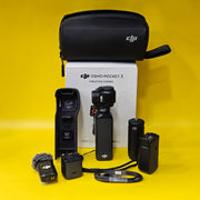 a) DJI Osmo Pocket 3 Creator Combo | 1-inch CMOS Sensor | 4K/120fps | 3-Axis Gimbal | Vlogging Camera Kit