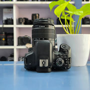 a) Canon EOS 750D DSLR Camera with 18-55mm III Lens | 18MP | Full HD Video | Flip Screen | Beginner Friendly | SK1034
