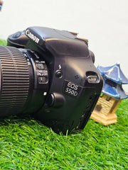 a) Canon EOS 550D DSLR with 18-55mm IS II Lens | 18MP APS-C | Full HD Video | Beginner Camera