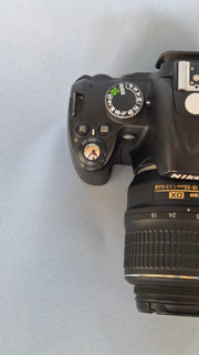 c) Nikon D3000 with 18-55mm Lens – 10.2MP DSLR Camera | Beginner Friendly | Sharp Image Quality