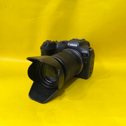 a) Canon EOS R7 with RF-S 18-150mm F3.5-6.3 IS STM Lens | 32.5MP APS-C Mirrorless Camera for Wildlife, Sports & Hybrid Creators | SK148