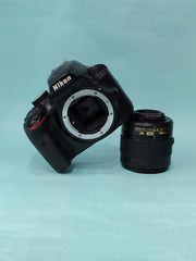 b) Nikon D3400 DSLR + AF-P 18-55mm VR Lens Kit | SK1012
