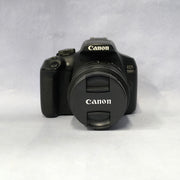 b) Canon EOS 1500D DSLR Camera with 18-55mm IS II Lens | 24.1MP | Full HD Video | WiFi | AB04