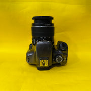 a) Canon EOS 1100D with 18-55mm f/3.5-5.6 IS II Lens | Beginner DSLR Camera for Photography & HD Video Shooting | SK196