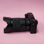 b) Sony A6400 Mirrorless Camera with 18-135mm f/3.5-5.6 OSS Lens | 24.2MP APS-C | 4K Video | Fast AF | SK522