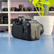 a) Canon EOS 750D DSLR Camera with 18-55mm III Lens | 18MP | Full HD Video | Flip Screen | Beginner Friendly | SK1034