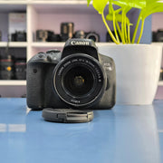 a) Canon EOS 750D DSLR Camera with 18-55mm III Lens | 18MP | Full HD Video | Flip Screen | Beginner Friendly | SK1034