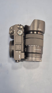 c) Sony Alpha A6400 + 18-135mm Zoom Lens (Excellent Condition)
