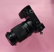 b) Sony A6400 Mirrorless Camera with 18-135mm f/3.5-5.6 OSS Lens | 24.2MP APS-C | 4K Video | Fast AF | SK522