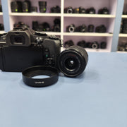 b) Panasonic Lumix G85 Mirrorless Camera Body – 4K Video & 5-Axis Stabilization | SK1023