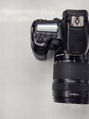 a) Canon EOS 70D DSLR Camera with 18-135mm IS Lens | 20.2MP APS-C Sensor | Dual Pixel Autofocus | Full HD Video | Versatile Zoom Kit | SK1053