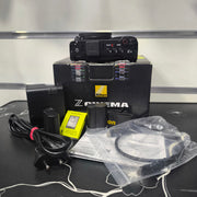 a) Nikon ZR cinema Professional Full-Frame Cinema Camera for Filmmakers & Content Creators | 6K RAW Video, RED Color Science & Advanced Cinematic Production | SK185