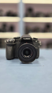 c) Panasonic Lumix G85 with 14-42mm Lens – 16MP 4K Mirrorless Camera | Weather-Sealed | 5-Axis Stabilization