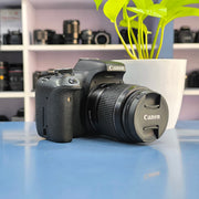 a) Canon EOS 750D DSLR Camera with 18-55mm III Lens | 18MP | Full HD Video | Flip Screen | Beginner Friendly | SK1034