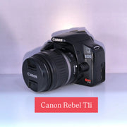 b) Canon EOS Rebel T1i DSLR Camera with 18-55mm Lens | 15.1MP | Full HD Video | Compact & Beginner Friendly | SK1032
