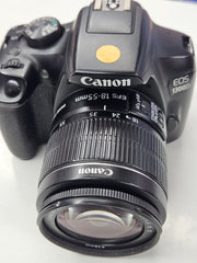 a) Canon EOS 1300D DSLR Camera with 18-55mm Lens | 18MP APS-C | Full HD Video | WiFi | Beginner Friendly DSLR