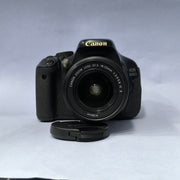 a) Canon EOS 600D DSLR Camera with 18-55mm Lens | 18MP | Vari-Angle Display | Perfect for Beginners & Creators SK1038