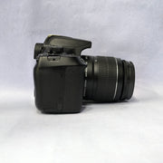 b) Canon EOS 1500D DSLR Camera with 18-55mm IS II Lens | 24.1MP | Full HD Video | WiFi | AB04
