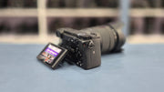 c) Sony Alpha A6400 + 18-135mm Zoom Lens (Excellent Condition)