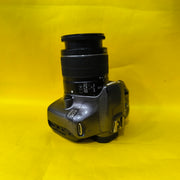 a) Canon EOS 1100D with 18-55mm f/3.5-5.6 IS II Lens | Beginner DSLR Camera for Photography & HD Video Shooting | SK196