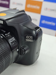 a) Canon EOS 1300D DSLR Camera with 18-55mm Lens | 18MP APS-C | Full HD Video | WiFi | Beginner Friendly DSLR