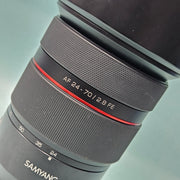 a) Samyang AF 24-70mm f/2.8 FE Lens | Sony E Mount Full Frame | Constant f/2.8 Aperture | Professional Standard Zoom Lens | Ideal for Portrait, Wedding, Video & Everyday Photography | SK1063