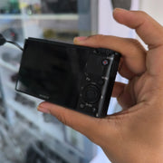 a) Sony DSC-RX100 Cyber-shot | Premium Compact Point & Shoot Camera | 20.2MP Cyber-shot Camera with Zeiss Lens | SK154