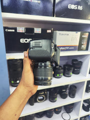 b) Canon EOS 700D DSLR Camera with 18-55mm IS II Lens | Full HD Video | Touchscreen Display | SK1009