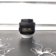 a) Nikon AF-S DX NIKKOR 35mm f/1.8G Lens | Fast Standard Prime Lens for Nikon DX DSLR Cameras | Portrait, Street & Low-Light Photography | SK176