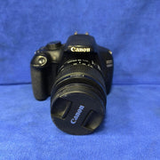 a) Canon EOS 1200D DSLR Camera with Canon EF-S 18-55mm Lens | 18MP Entry-Level DSLR Camera Kit for Photography, Travel & Beginner Content Creation | SK192
