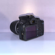 b) Canon EOS Rebel T1i DSLR Camera with 18-55mm Lens | 15.1MP | Full HD Video | Compact & Beginner Friendly | SK1032