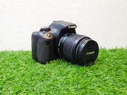 a) Canon EOS 550D DSLR with 18-55mm IS II Lens | 18MP APS-C | Full HD Video | Beginner Camera