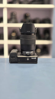 c) Sony Alpha A6400 + 18-135mm Zoom Lens (Excellent Condition)