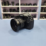 b) Panasonic Lumix G85 Mirrorless Camera Body – 4K Video & 5-Axis Stabilization | SK1023