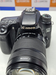 a) Canon EOS 70D DSLR Camera with 18-135mm IS Lens | 20.2MP APS-C Sensor | Dual Pixel Autofocus | Full HD Video | Versatile Zoom Kit | SK1053