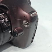 a) Canon EOS 1100D DSLR Camera with 18-55mm IS II Lens | 12.2MP APS-C | Beginner Friendly Camera | Lightweight DSLR | (Code AB01)