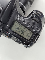 a) Canon EOS 70D DSLR Camera with 18-135mm IS Lens | 20.2MP APS-C Sensor | Dual Pixel Autofocus | Full HD Video | Versatile Zoom Kit | SK1053