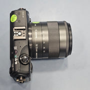a) Canon EOS M Mirrorless Camera with 18-55mm Lens | Compact APS-C Camera (Code: AB36)
