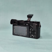 c) Sony A6100 Mirrorless Camera with Kit Lens – Excellent Condition