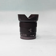 a) Sony E 11mm f/1.8 Ultra Wide-Angle Prime Lens | APS-C E-Mount | Fast f/1.8 Aperture | Lightweight Vlogging & Landscape Lens | SK1058