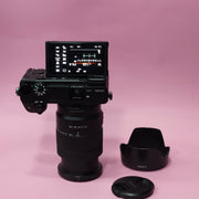 b) Sony A6400 Mirrorless Camera with 18-135mm f/3.5-5.6 OSS Lens | 24.2MP APS-C | 4K Video | Fast AF | SK522